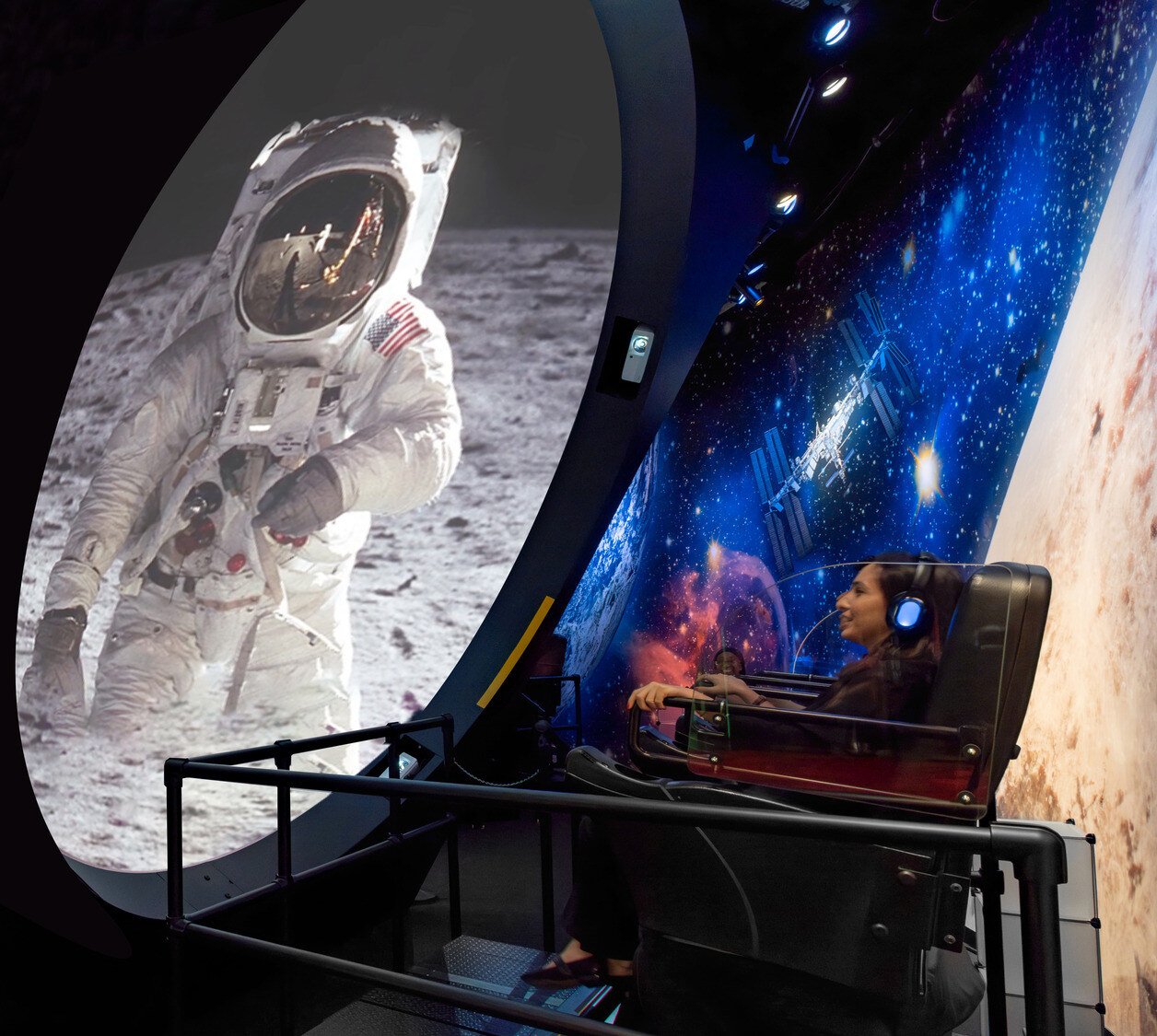 Visitor viewing the moon landing in a curved projection