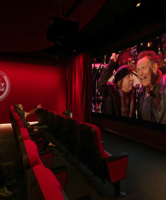 A cinema showing a media production of the inductees