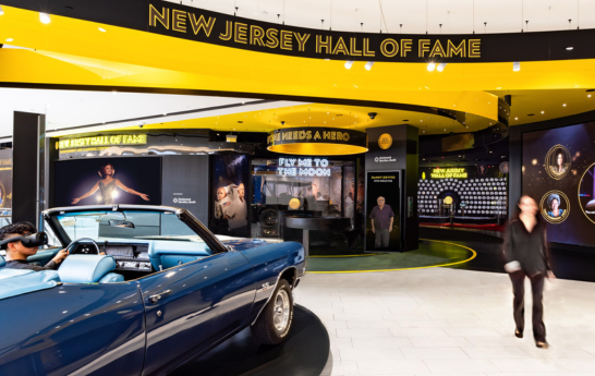 The entry space of the New Jersey Hall of Fame with a car and a map that shows the inductees